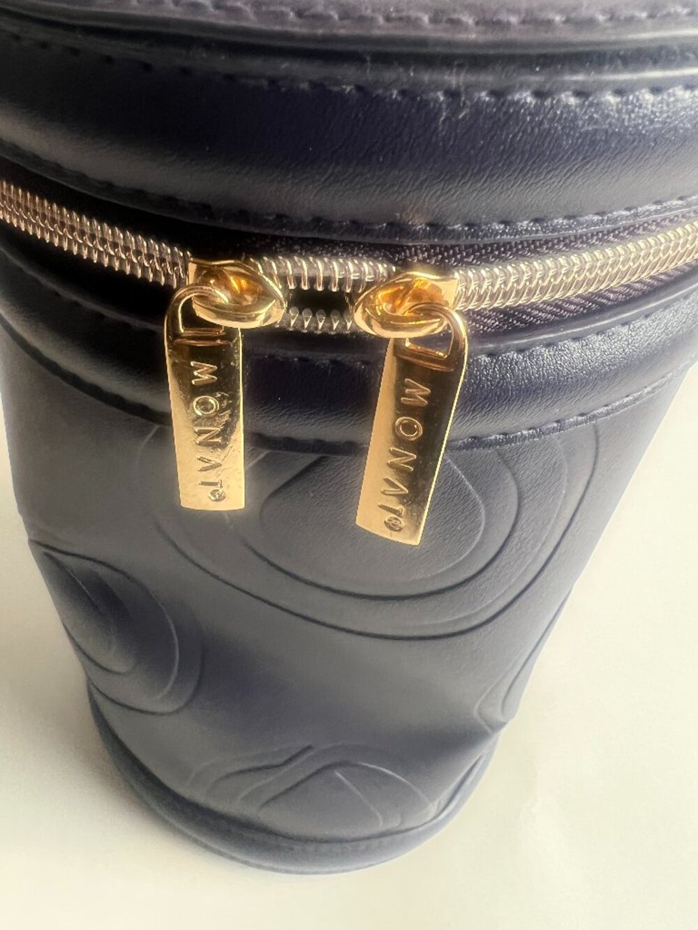 MONAT Navy Embossed Cylinder Vanity Train Case Gold Hardware Luxe Travel Bag